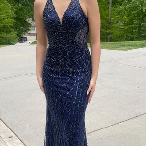 Beautiful Navy blue prom dress with shoes and earrings.